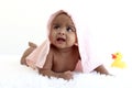 Portrait of adorable six month crawling African American baby covered in towel after bath time, happy smiling sweet little girl Royalty Free Stock Photo