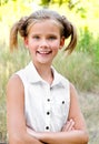 Portrait of adorable smiling little girl child in dress outdoor