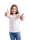 Portrait of adorable smiling little girl child in jeans and white t-shirt with two fingers up isolated Royalty Free Stock Photo