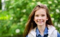 Portrait of adorable smiling little girl child pre teen in the park Royalty Free Stock Photo