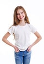 Portrait of adorable smiling little girl child preteen in jeans and white t-shirt isolated Royalty Free Stock Photo
