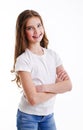 Portrait of adorable smiling little girl child preteen in jeans and white t-shirt isolated Royalty Free Stock Photo