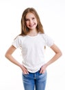 Portrait of adorable smiling little girl child preteen in jeans and white t-shirt isolated Royalty Free Stock Photo