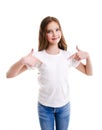 Portrait of adorable smiling little girl child preteen in the white t-shirt pointing to yourself by forefingers isolated Royalty Free Stock Photo