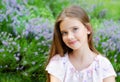Portrait of adorable smiling little girl child in summer day. Happy preteen in the park Royalty Free Stock Photo