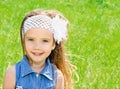 Portrait of adorable smiling little girl on the meadow Royalty Free Stock Photo