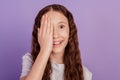 Portrait of adorable sweet small lady palm close half face look camera eye examination on purple background