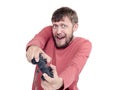 Portrait of adult bearded man holding joystick and playing videogames, isolated on white background Royalty Free Stock Photo