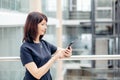 Adult businesswomen in suit using smartphone Royalty Free Stock Photo