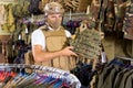 Male customer try on ammunition with rifle