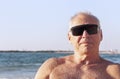 Portrait of an adult man sunbathing on the sea Royalty Free Stock Photo