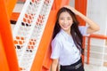 Portrait of an adult Thai student in university student uniform. Asian cute girl standing smiling happily where her teeth are Royalty Free Stock Photo