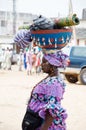 Portrait of an adult woman loading a calabash.