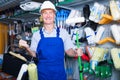 Portrait of adult workman choosing soft roller