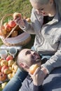 Portrait of adults with apples and sandwitches in nature Royalty Free Stock Photo