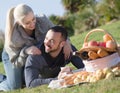 Portrait of adults with apples and sandwitches in nature Royalty Free Stock Photo