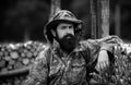 Portrait of adventure serious man extreme explorer. Man hunter in camouflage outdoor. Brutal hunter, bearded man in the Royalty Free Stock Photo