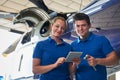 Portrait Of Aero Engineer And Apprentice Working On Helicopter I