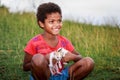 Portrait of Aeta tribe little girl with her cute cat near Mount