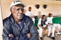 Portrait of african american Baseball Coach Watching From Dugout
