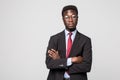 Portrait of African American business man with folded arms, isolated on greybackground Royalty Free Stock Photo