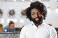 Portrait of african american businessman standing in hotel lobby Royalty Free Stock Photo