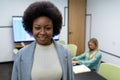 Portrait of african american businesswoman in meeting room looking to camera and smiling Royalty Free Stock Photo