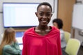 Portrait of african american businesswoman in meeting room looking to camera and smiling Royalty Free Stock Photo