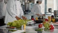 Portrait of african american cook in uniform making meal preparations Royalty Free Stock Photo