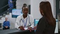 Portrait of african american doctor working on chekcup reports