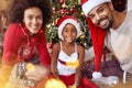 Portrait of African American family in front of Christmas tree Royalty Free Stock Photo