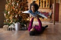 Portrait African American father carrying daughter, celebrating Christmas at home Royalty Free Stock Photo