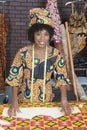 Portrait of an African American female fashion designer with sewing pattern and cloth