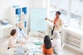 African-American Woman Giving Presentation at Business Meeting Royalty Free Stock Photo