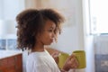 Portrait of African American girl with mugs Royalty Free Stock Photo