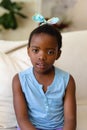 Portrait of african american girl sitting on the couch at home Royalty Free Stock Photo