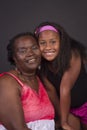 Portrait of an African American grandmother with her  granddaughter in an intimate and happy momen Royalty Free Stock Photo