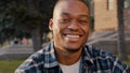 Portrait african american happy carefree cheerful smiling man guy looking into distance thinking turns to camera with Royalty Free Stock Photo