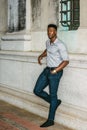 Young black man standing on street in New York City, thinking Royalty Free Stock Photo