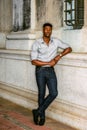 Young black man standing on street in New York City, thinking Royalty Free Stock Photo