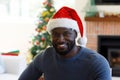 Portrait of african american man wearing santa hat Royalty Free Stock Photo
