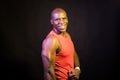 Portrait of an African American man wearing tank top standing looking at camera. Royalty Free Stock Photo