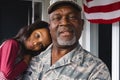 Portrait of african american military senior man carrying and cuddling biracial granddaughter Royalty Free Stock Photo