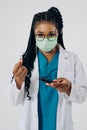 Portrait of african american nurse or doctor woman wearing medical face mask Royalty Free Stock Photo