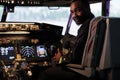 Portrait of african american pilot using dashboard command in cabin Royalty Free Stock Photo