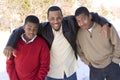 Portrait of African American teenage brothers smiling.