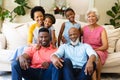 Portrait of african american three generation family smiling while sitting together on couch at home Royalty Free Stock Photo