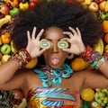 Portrait of an African American woman closing her eyes with kiwi Royalty Free Stock Photo
