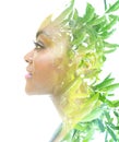 A portrait of an African American woman combined with an image of green leaves in a double exposure technique. Royalty Free Stock Photo