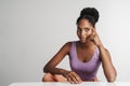 Portrait of african american woman looking aside while sitting Royalty Free Stock Photo